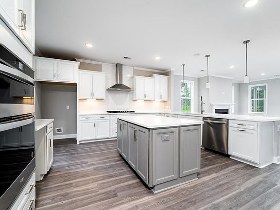 The kitchen allows you entertain as it opens to the Gathering Room.
