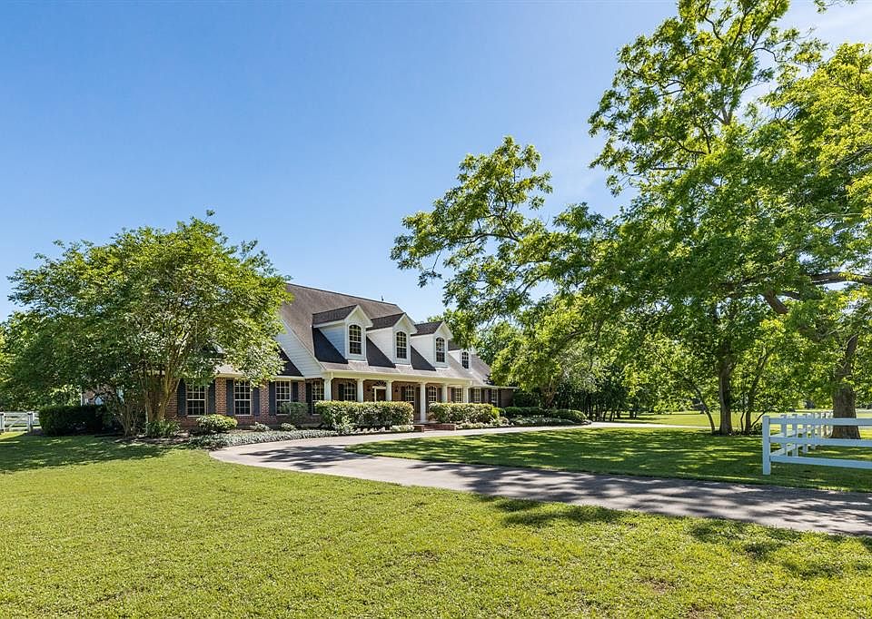 835 Split Elm Dr, a classic red brick house with seven bedrooms, four full and one half bath, formal dining, game room and a pool!