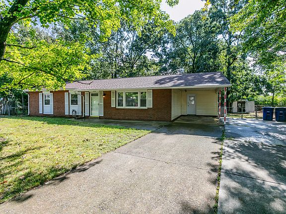 Large driveway and carport