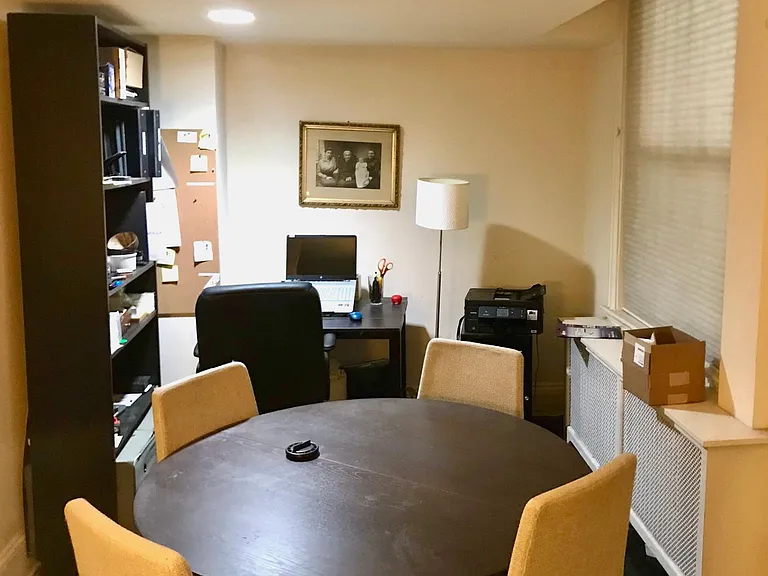 Dining/ living area adjacent to kitchen area; used instead as an office by a previous tenant