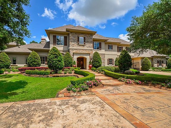 Has a circle driveway and private gate access to court yard.