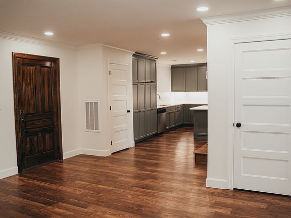 Dining area looking towards the front door and kitchen.
