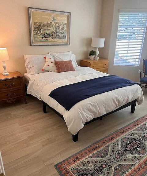 2nd bedroom with queen bed. Oversized with plenty of room to relax. Double closets. Overlooks front yard.
