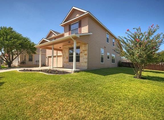 Front of the home showing the corner lot yard