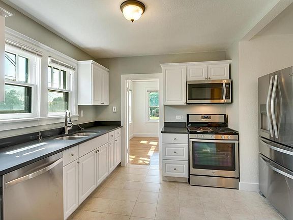 Completely Remodeled Kitchen with Stainless Steel Appliances and Granite Counter
