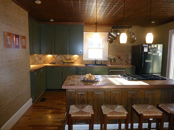 stone tops/splash, granite sink, copper ceiling