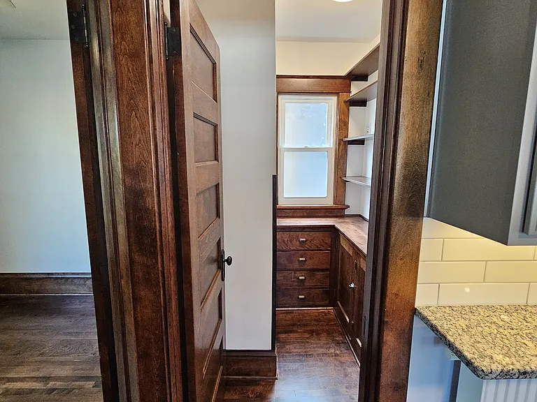 Pantry is accessible through the kitchen.