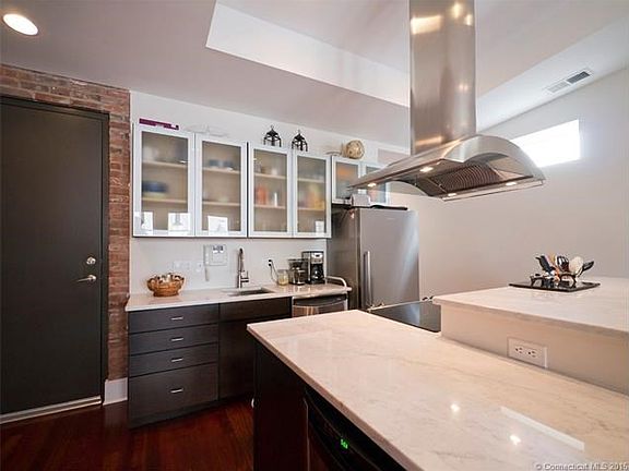 State of the art kitchen with cararra marble countertops