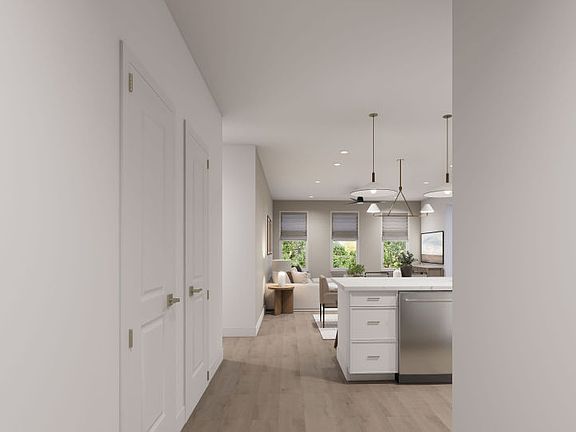 Welcoming Entryway Looks Into The Kitchen