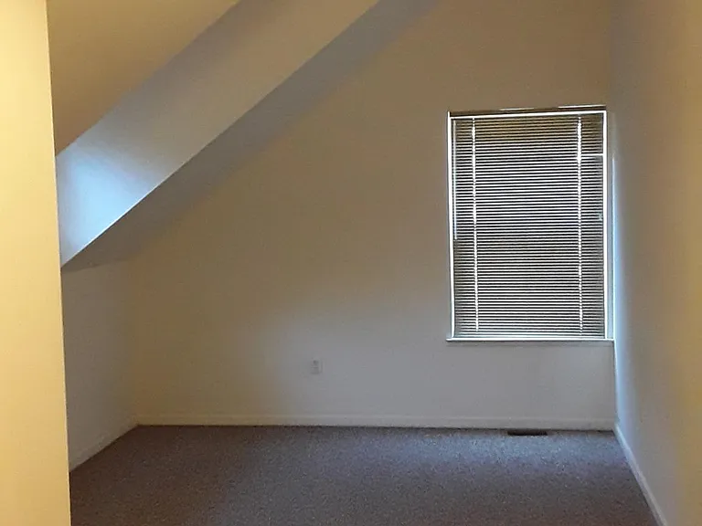 Bedroom with dormer and cathedral ceiling
