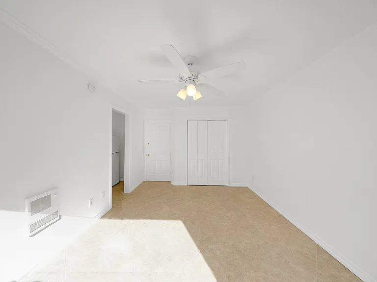 Living area looking at front door and closet