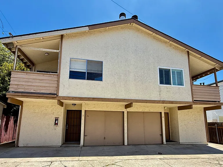 Enter from the alley side into the garage with a remote or the front door. Unit #3 is on the left.
