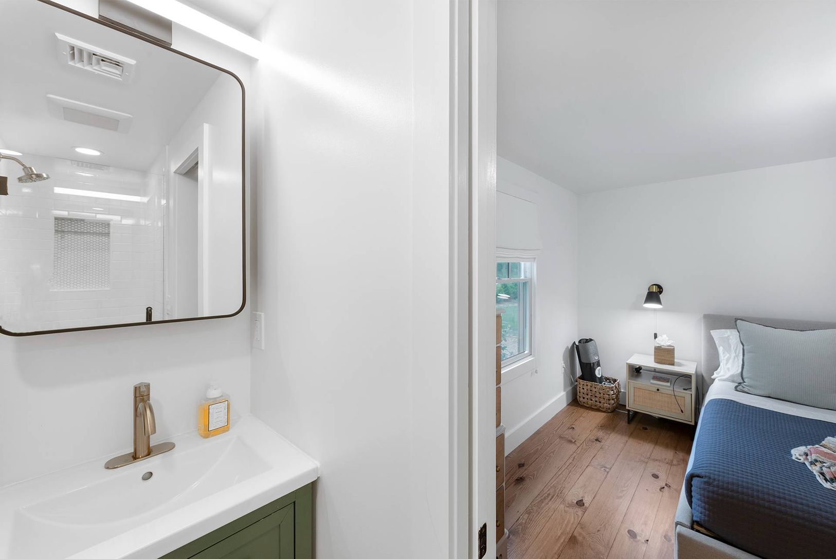  newly renovated primary bathroom with custom shower and plenty of storage