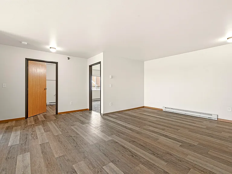 Step into the inviting open layout of Paramount at the Bluffs Apartments, featuring modern finishes and abundant natural light. This spacious living area is perfect for your personal touch. Schedule a tour today to envision your new home!