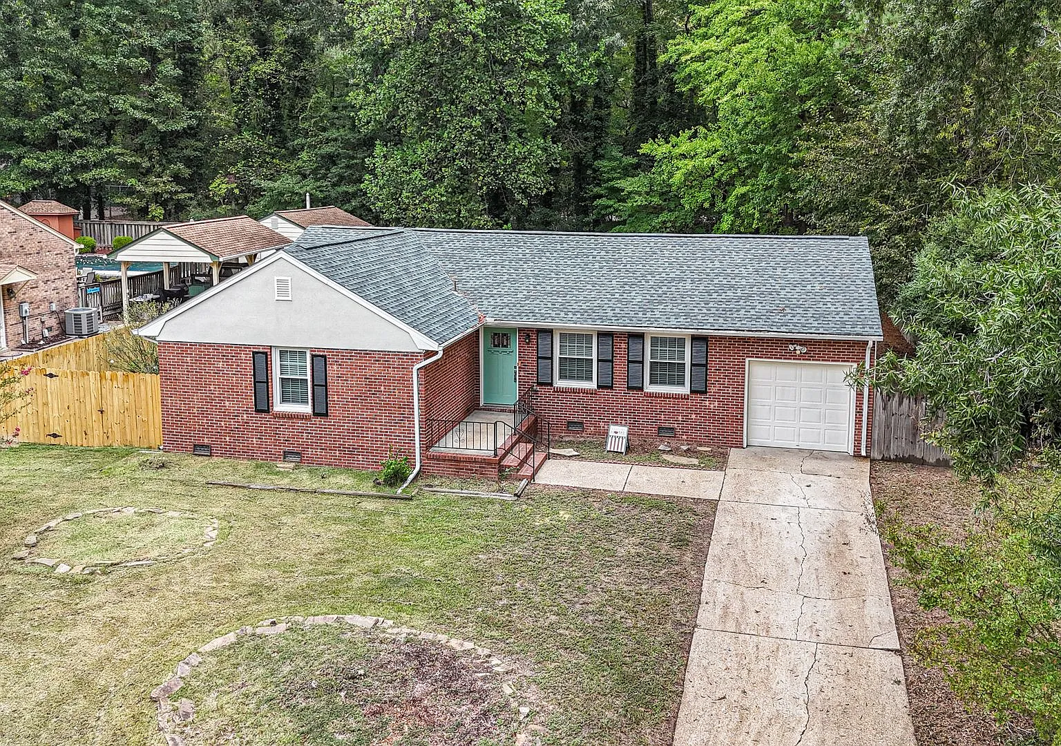 Fully Updated Brick Rancher with Huge Fenced Yard Walk to Outlets! — Photo 1