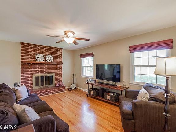 Living Room boasting brick wood FP/mantel