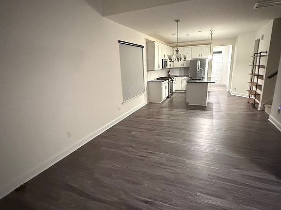 Open living/ dining/ kitchen.