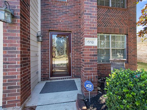 Covered patio, security storm door & a leaded glass bevel door
