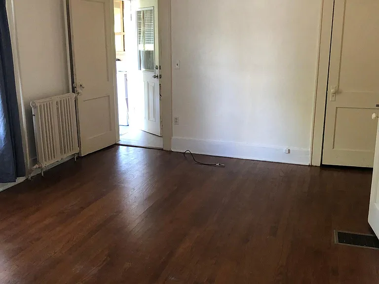 Large bedroom with 2 closets. Hardwood floors.