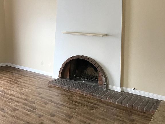 Fireplace rises to high ceiling