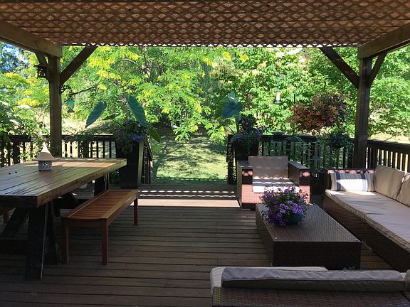 Backyard has 20 x 20 deck with large pergola