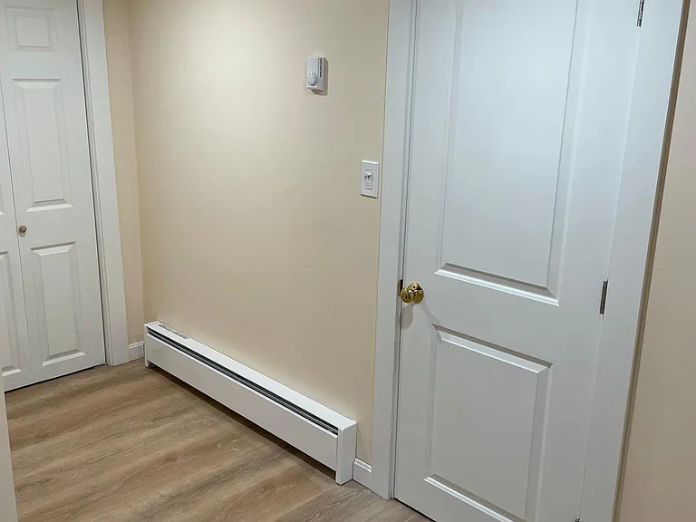 Each heater has its own thermostat mounted five feet above it on the wall.