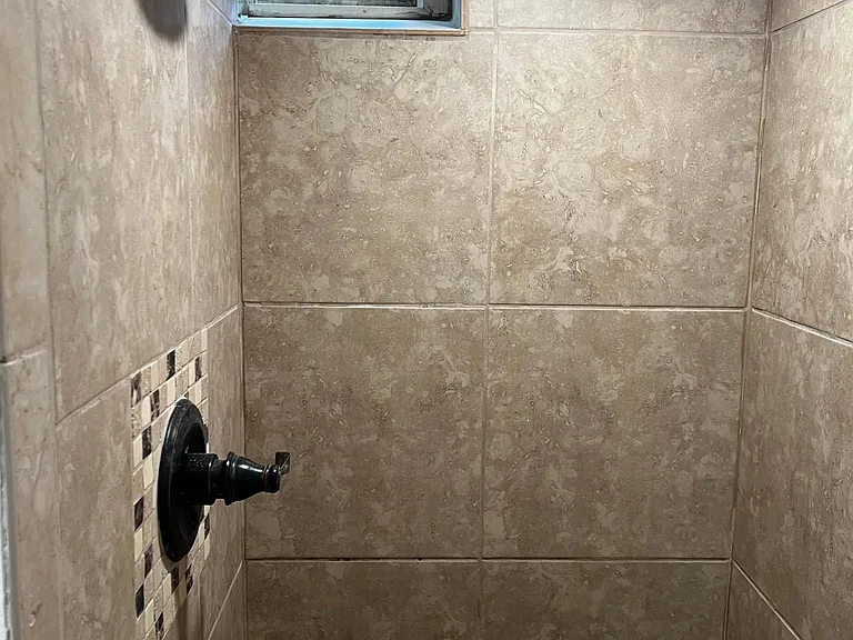 basement bathroom with, new tile, fixtures and toliet.