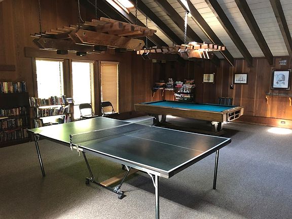 Clubhouse large TV, pool table, Table Tennis and Gym next to large pool area.