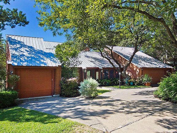 Lush landscaping accents the clean design of this  unique 5300 sq. ft. home.