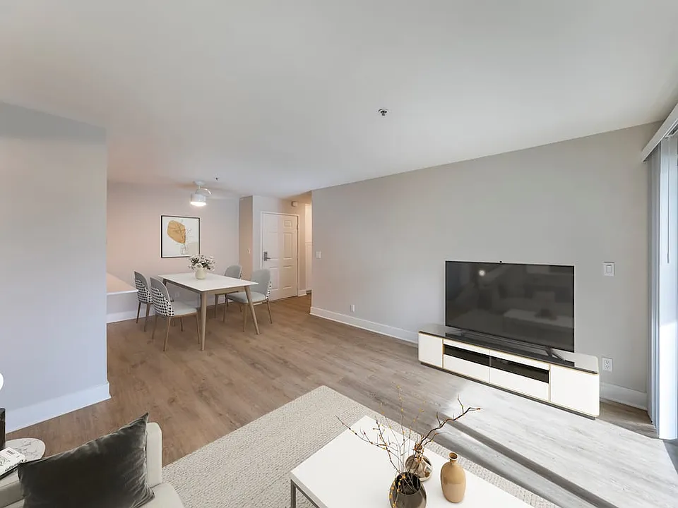 Renovated Package I dining and living room with hard surface flooring