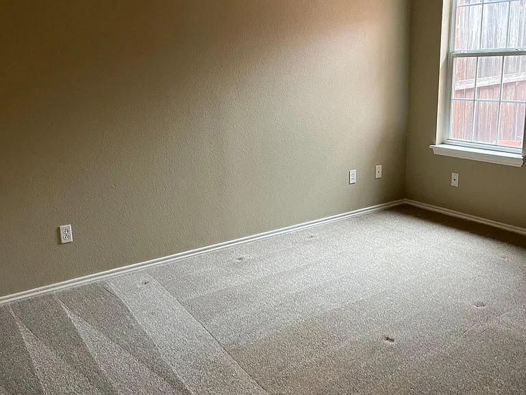 Guest bedroom looking out on private fenced yard