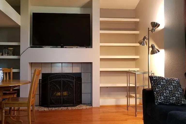 view from sitting on the couch.
Books, DVD's, and scrabble game plus cribbage board have been added to the shelves since this picture.