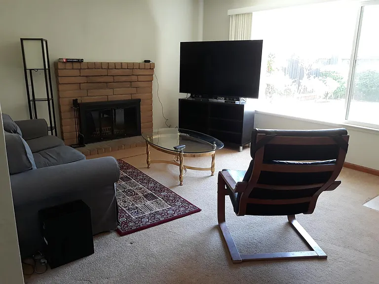 Living room. Window is to front courtyard.