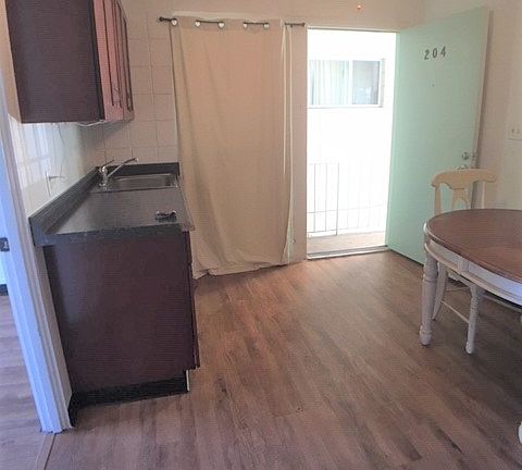 Living Room and Kitchen Area Back To Front