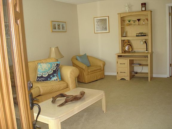 Livingroom staged with furnishings.