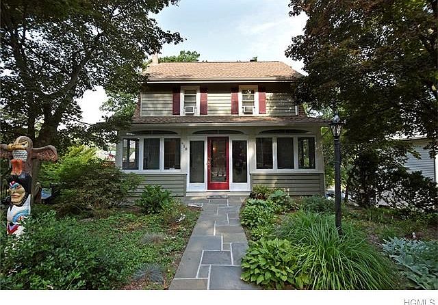 Charm filled colonial home with lovely front porch.