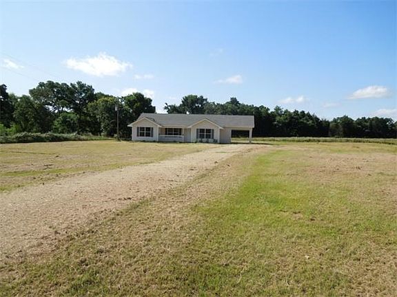 View of home from road, pond is to the left.