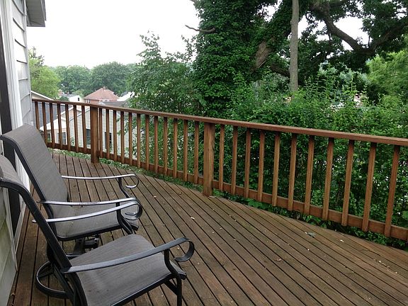 Side yard deck facing sunsets for grilling and entertaining.