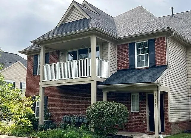 Corner house with woods in the front
