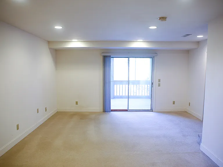 Den off of the basement bedroom with deck/porch/screened in.