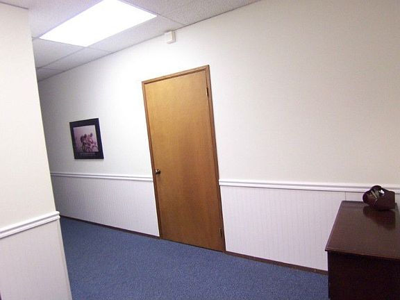 Entry w/ wainscoting, huge storage closet