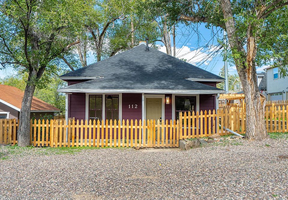Front of home with brand new fence