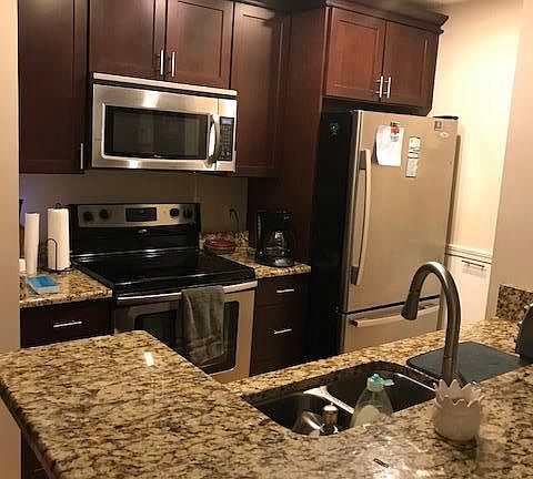 CUSTOM KITCHEN WITH STAINLESS STEEL APPLIANCE