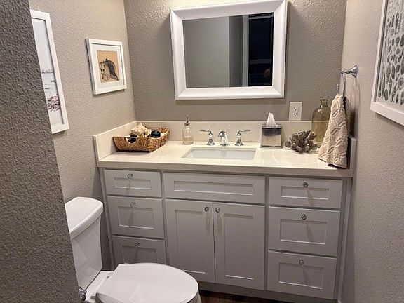 Downstairs guest bathroom with upgraded sink and cabinets.
