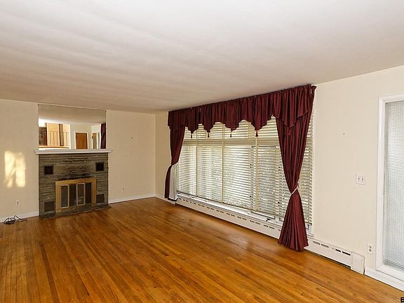 With wood burning fireplace & hardwood floor
