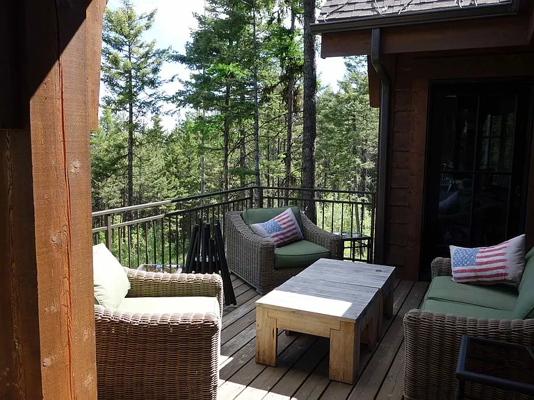 Deck off main level in back of house, one door to family room, one door to master bedroom