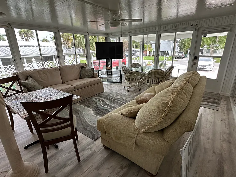 An additional, 500 sq ft of beautifully finished enclosed lanai (used as family room and work shop) under A/C added to house in 2010. Making the property over 2,000 sq ft under A/C.