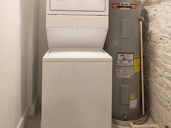 Studio apartment with dedicated laundry and storage room.