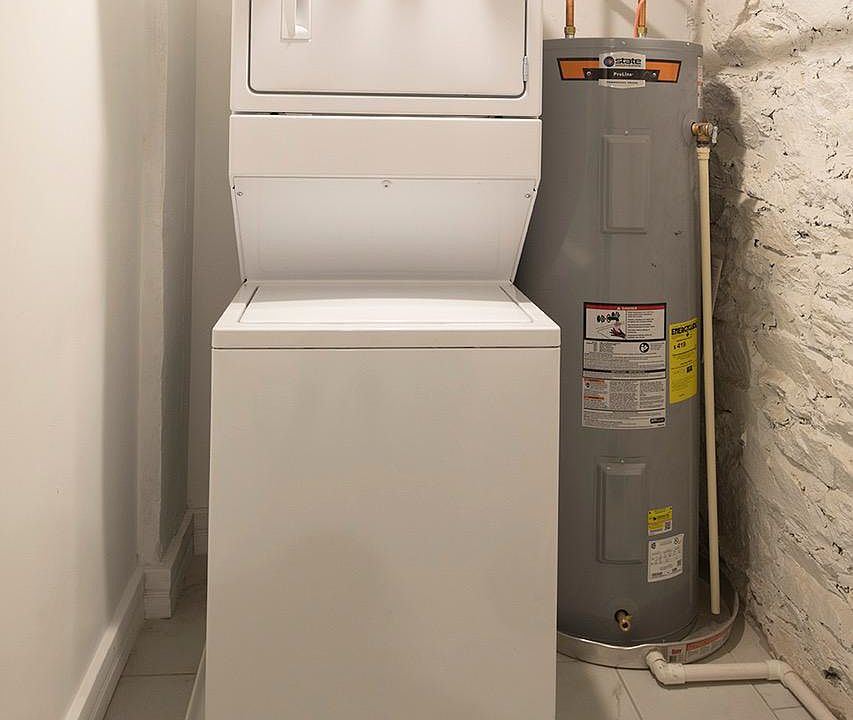 Studio apartment with dedicated laundry and storage room.