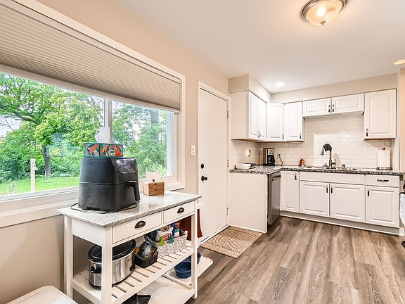 Granite countertops and tile backsplash.